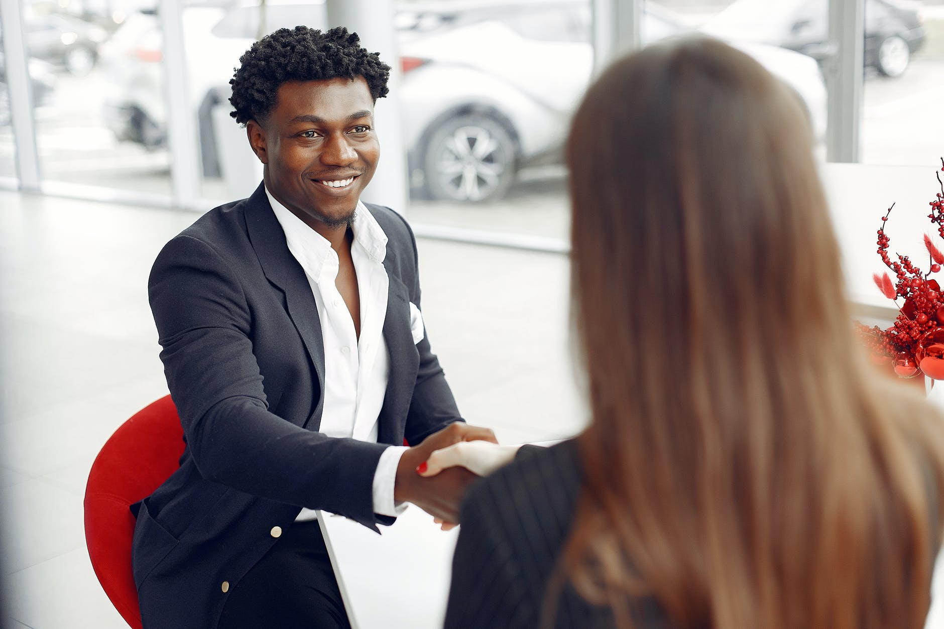 excited buyer shaking hands with agent