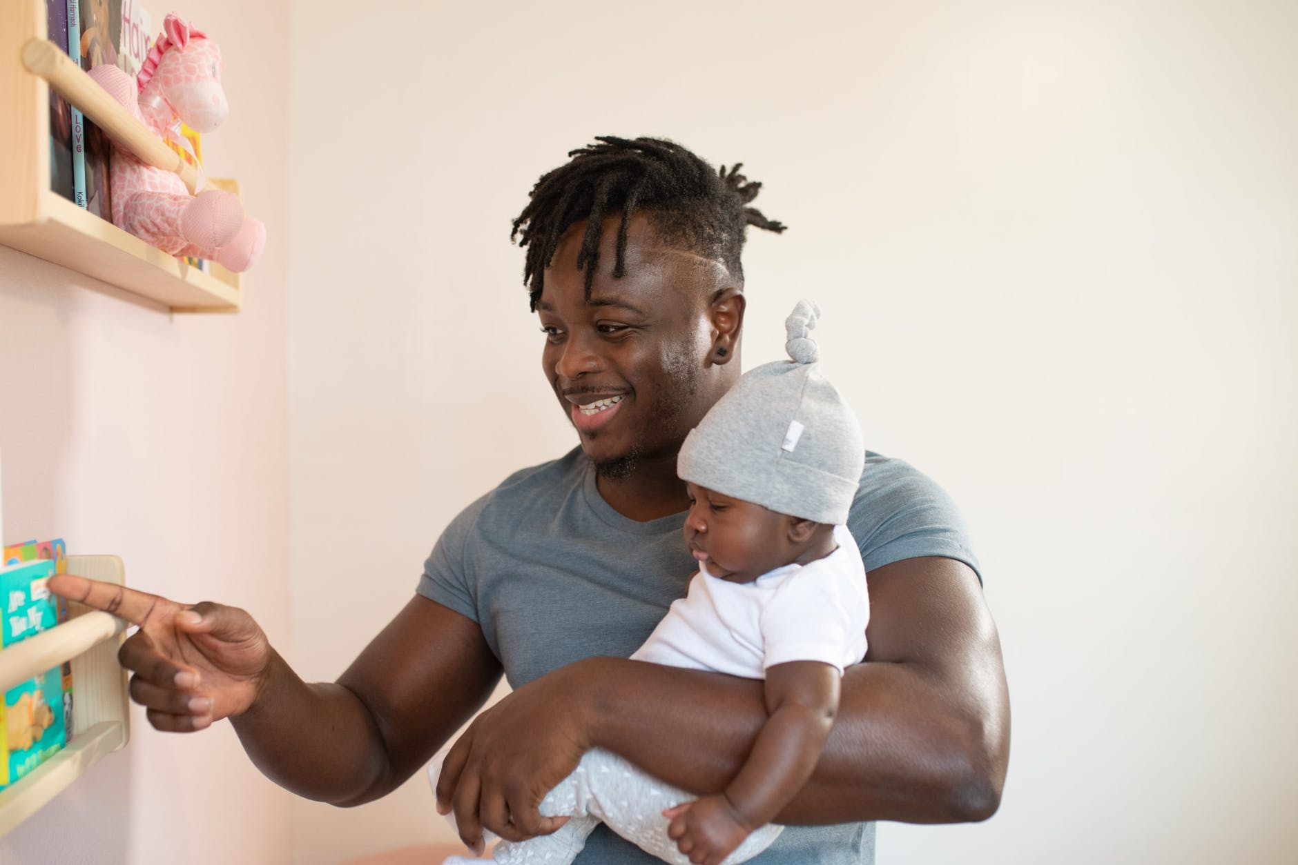 man carrying his baby